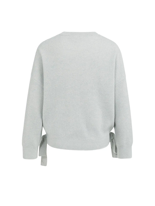 Knitted sweater with tie details at the hem